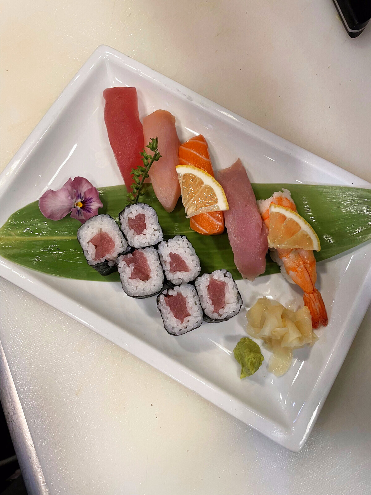Omakase sushi and sashimi course with tuna, salmon, yellowtail, and shrimp